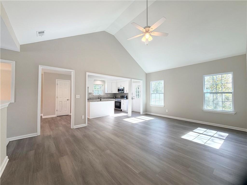 382 Arlington Lane Commerce, GA 30529 - Photo 15 of 43 a view of empty room with wooden floor and fan