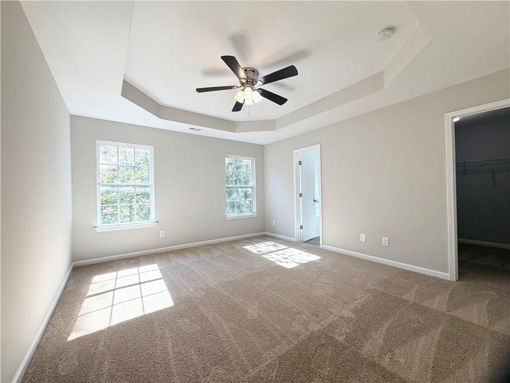 382 Arlington Lane Commerce, GA 30529 - Photo 17 of 43 a view of empty room with windows and ceiling fan