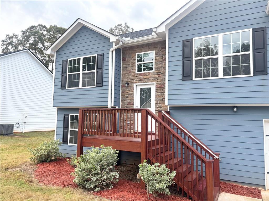 382 Arlington Lane Commerce, GA 30529 - Photo 2 of 43 a view of a house with wooden floor and a fence