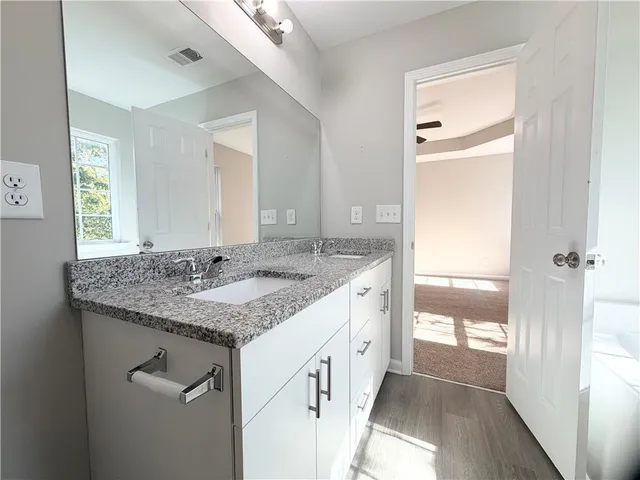 a bath tub sitting next to a window