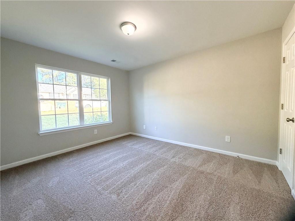 382 Arlington Lane Commerce, GA 30529 - Photo 32 of 43 an empty room with a window