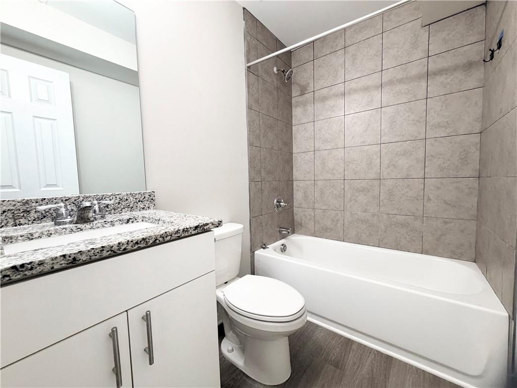 382 Arlington Lane Commerce, GA 30529 - Photo 38 of 43 a bathroom with a sink a toilet and a bathtub