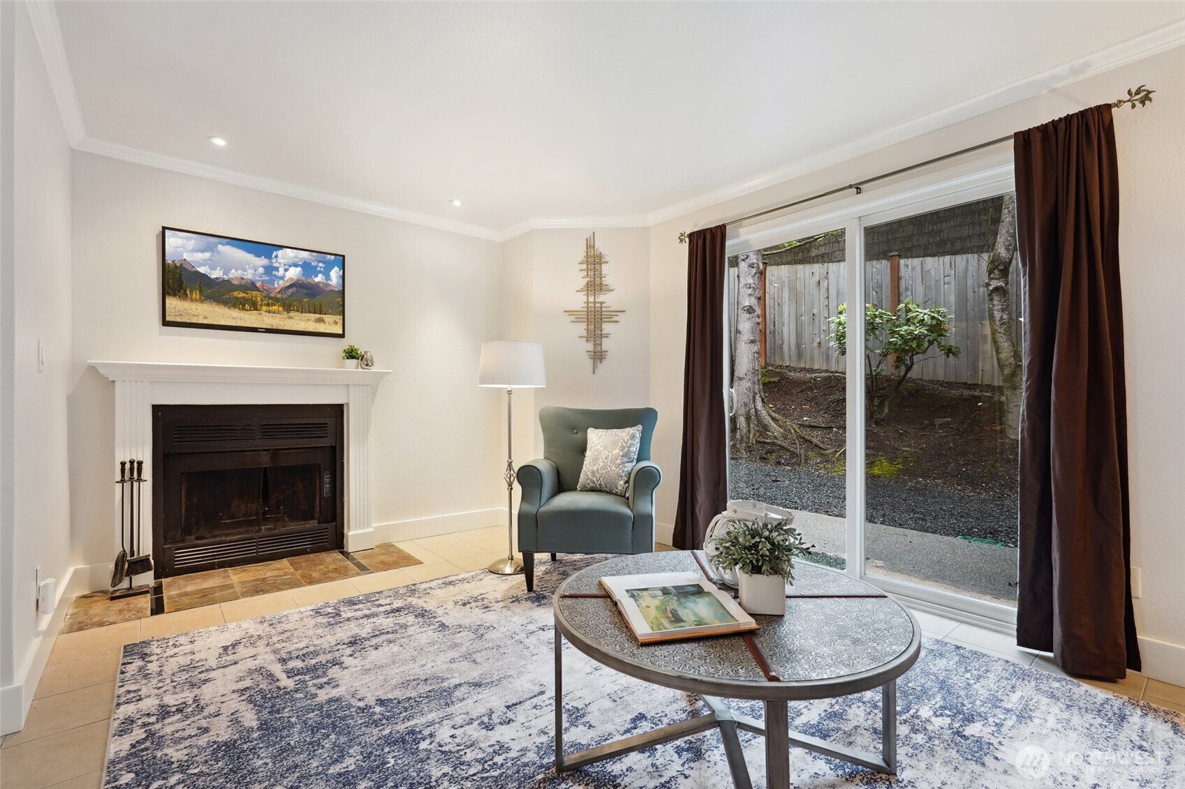 18910 Bothell Everett Highway, Unit K2 Bothell, WA 98012 - Photo 11 of 34 a living room with furniture a window and a fireplace