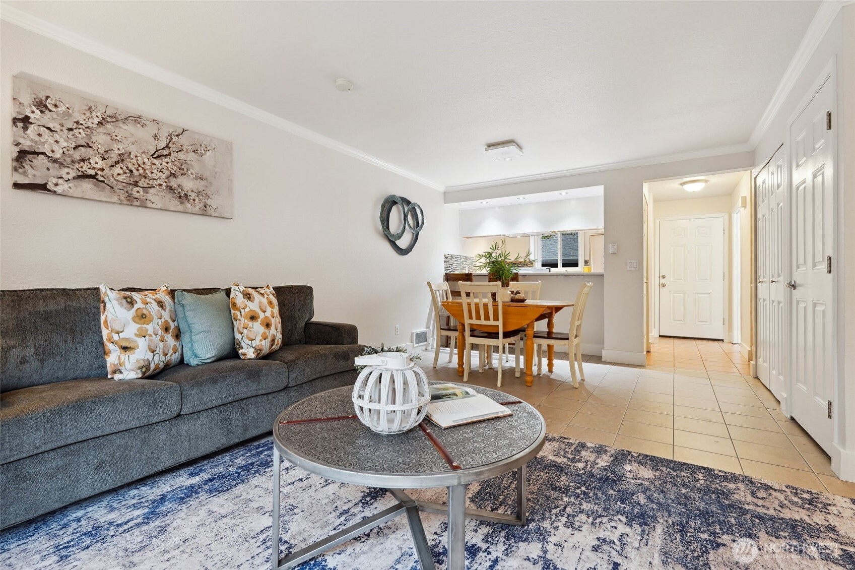 18910 Bothell Everett Highway, Unit K2 Bothell, WA 98012 - Photo 12 of 34 a living room with furniture and a table