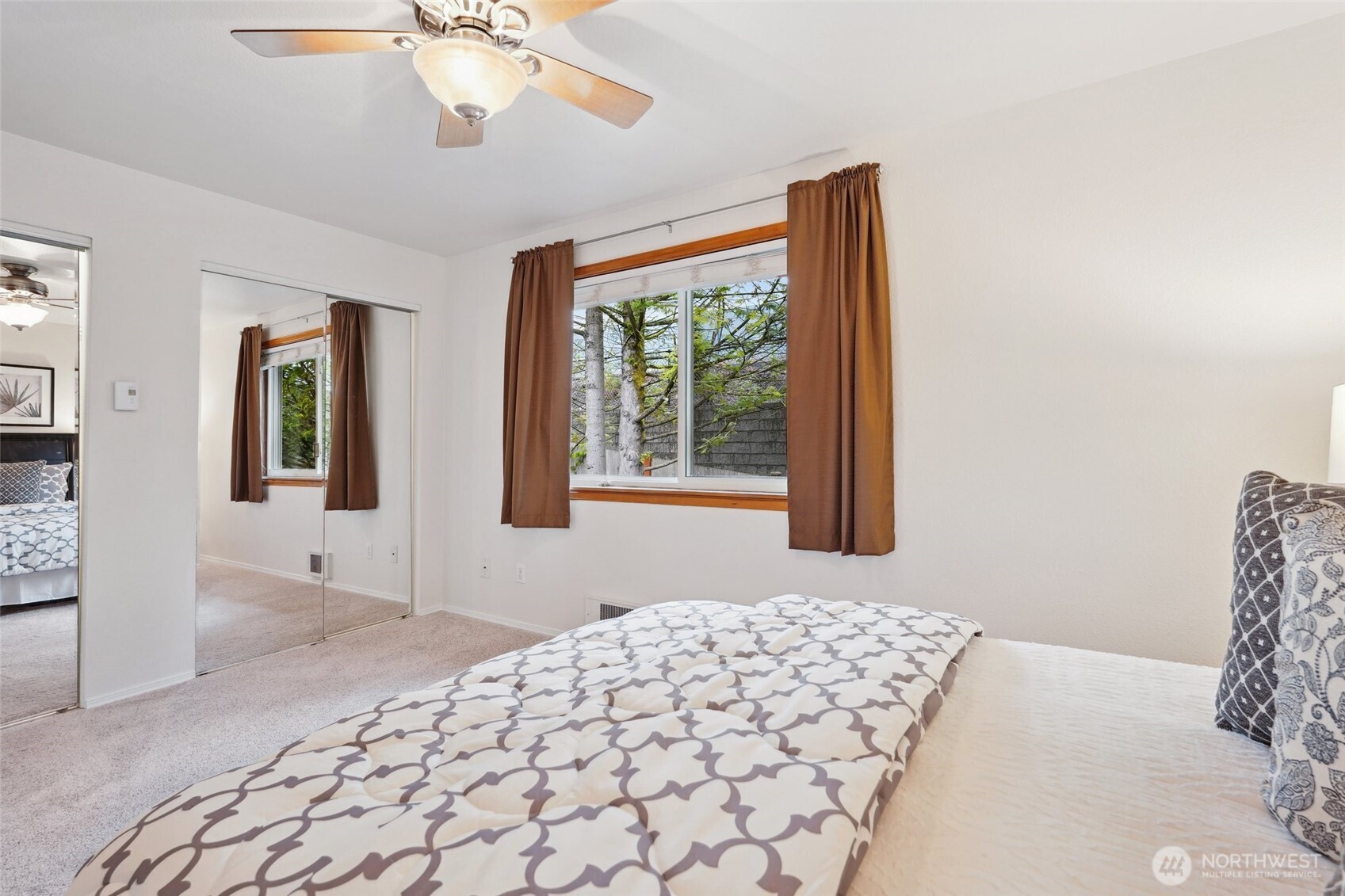 18910 Bothell Everett Highway, Unit K2 Bothell, WA 98012 - Photo 17 of 34 a bedroom with a bed and a window
