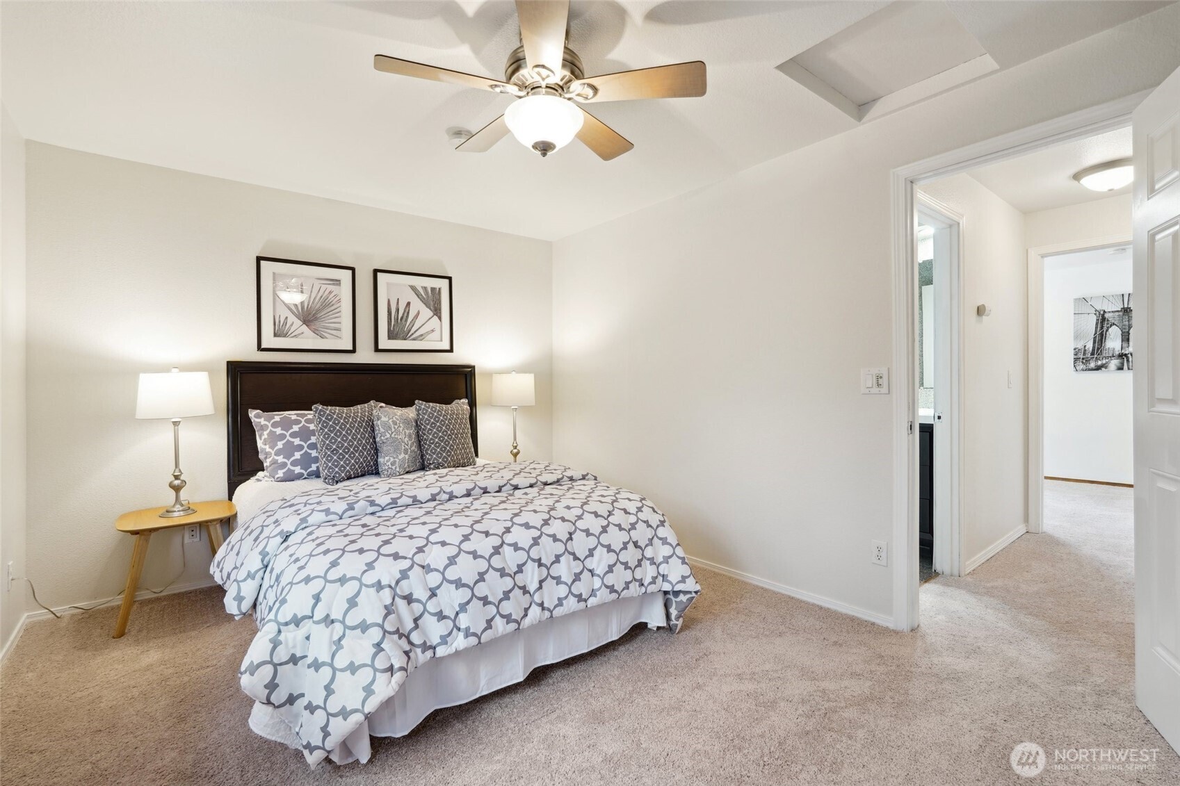 18910 Bothell Everett Highway, Unit K2 Bothell, WA 98012 - Photo 18 of 34 a bedroom with a bed and a ceiling fan