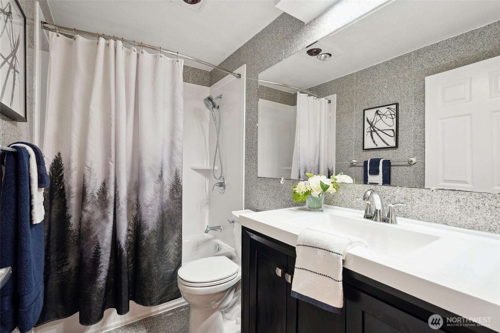 18910 Bothell Everett Highway, Unit K2 Bothell, WA 98012 - Photo 19 of 34 a bathroom with a double vanity sink toilet and a shower