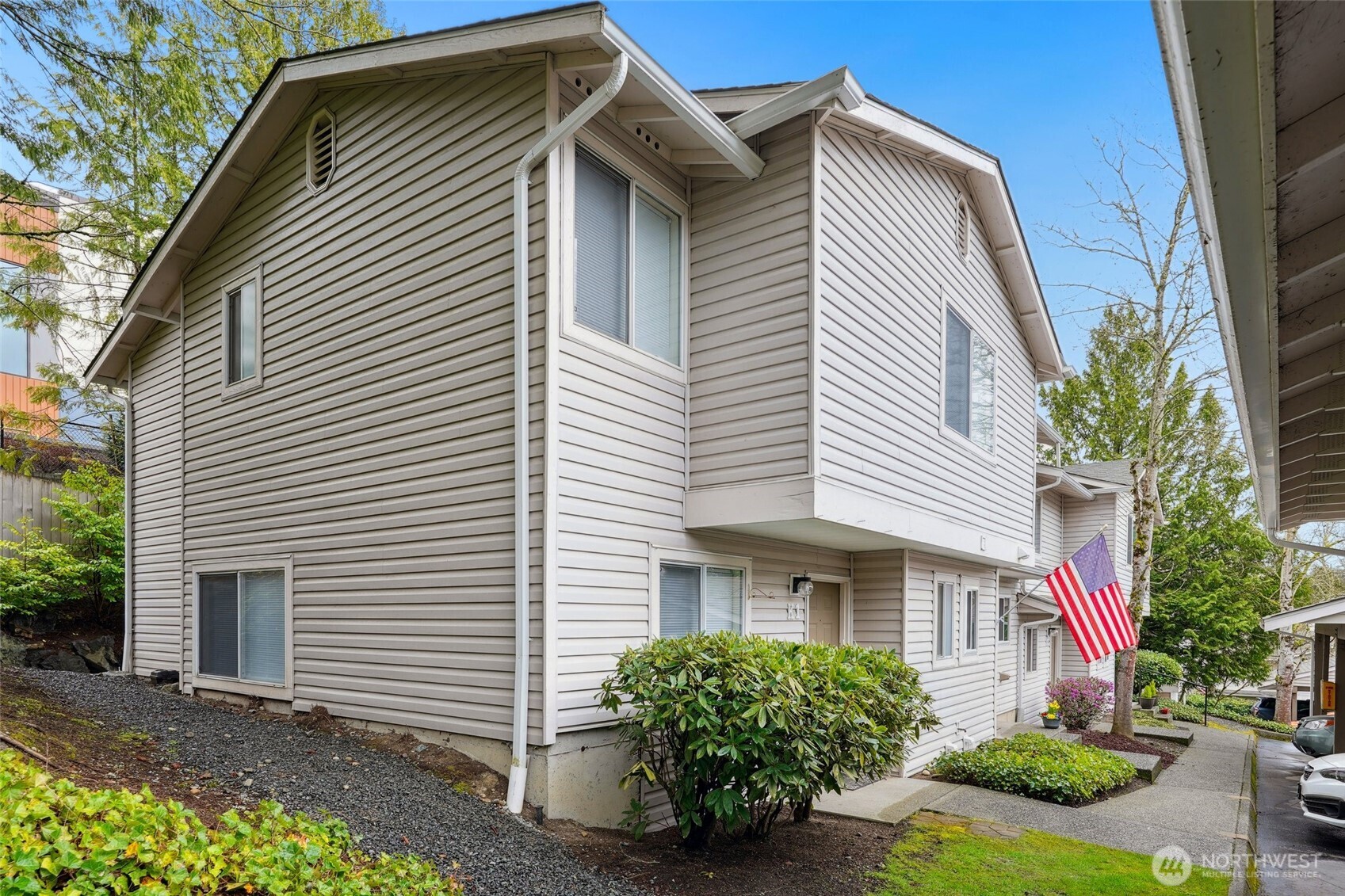 18910 Bothell Everett Highway, Unit K2 Bothell, WA 98012 - Photo 2 of 34 a front view of a house with garden