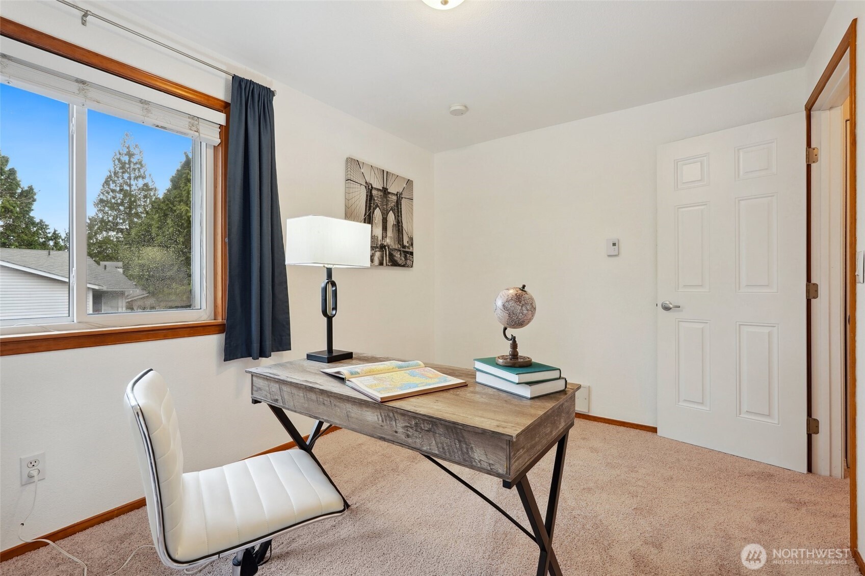 18910 Bothell Everett Highway, Unit K2 Bothell, WA 98012 - Photo 21 of 34 a view of a workspace with furniture and a window