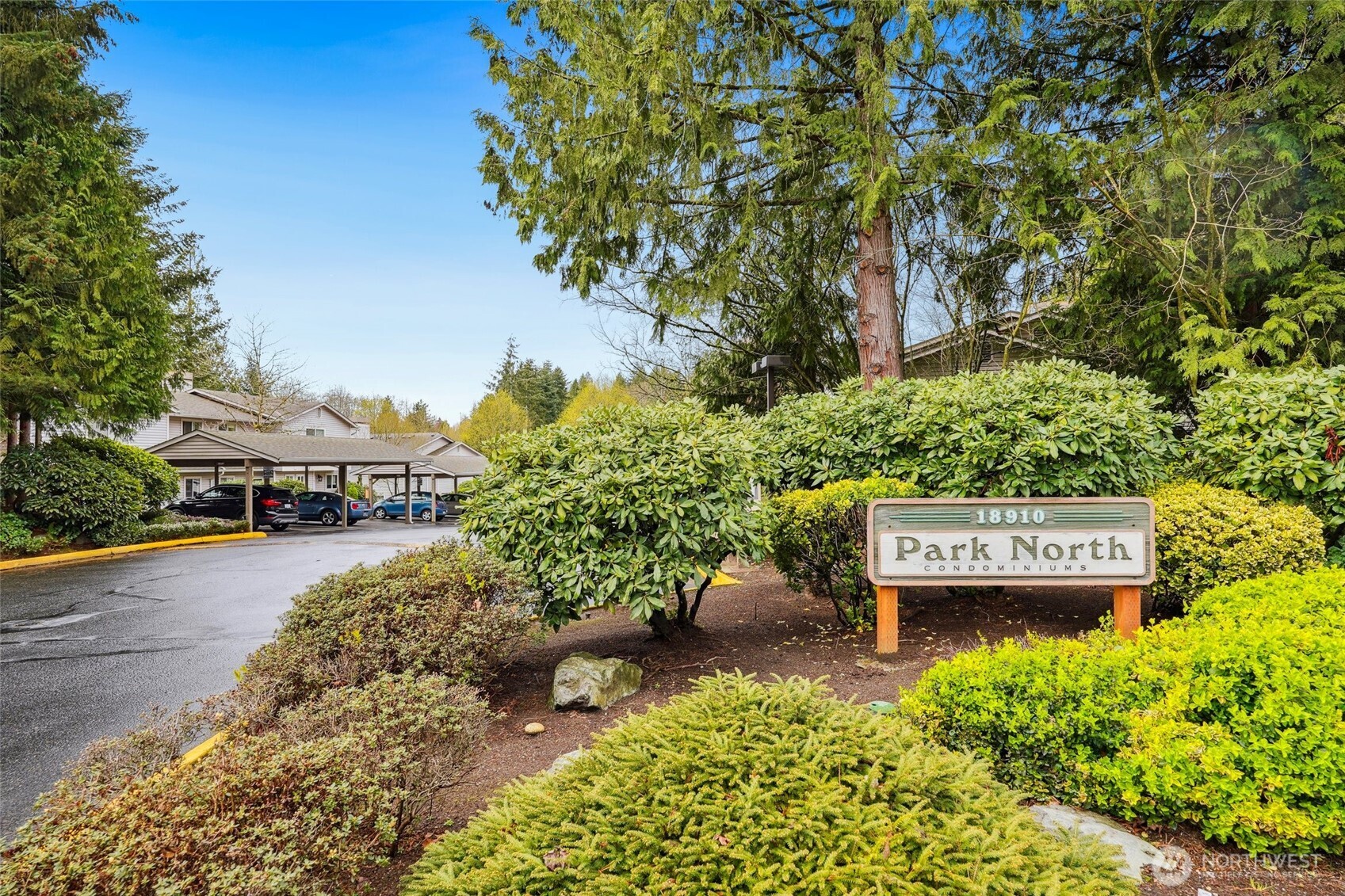 18910 Bothell Everett Highway, Unit K2 Bothell, WA 98012 - Photo 25 of 34 a view of a house with a yard and potted plants