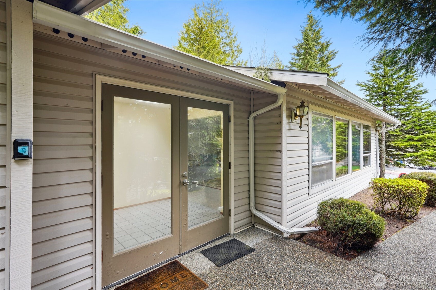 18910 Bothell Everett Highway, Unit K2 Bothell, WA 98012 - Photo 29 of 34 a view of a house with a backyard