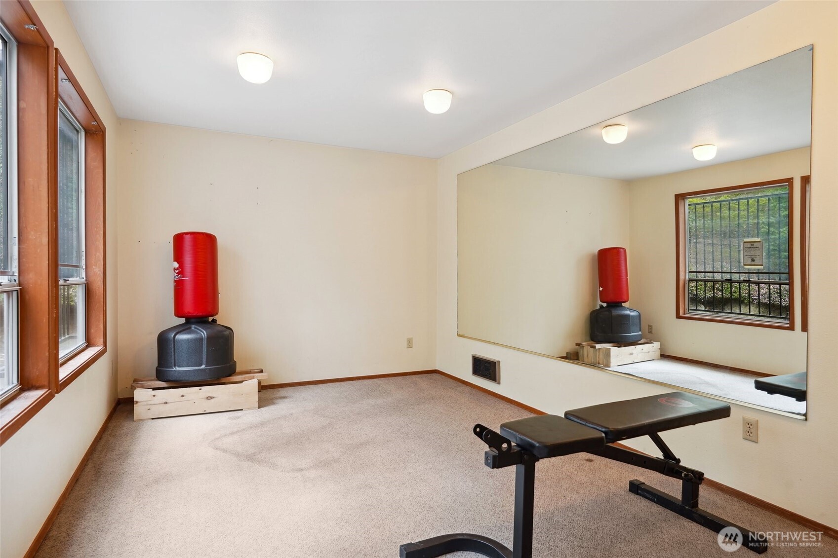 18910 Bothell Everett Highway, Unit K2 Bothell, WA 98012 - Photo 30 of 34 a room with furniture and wooden floor