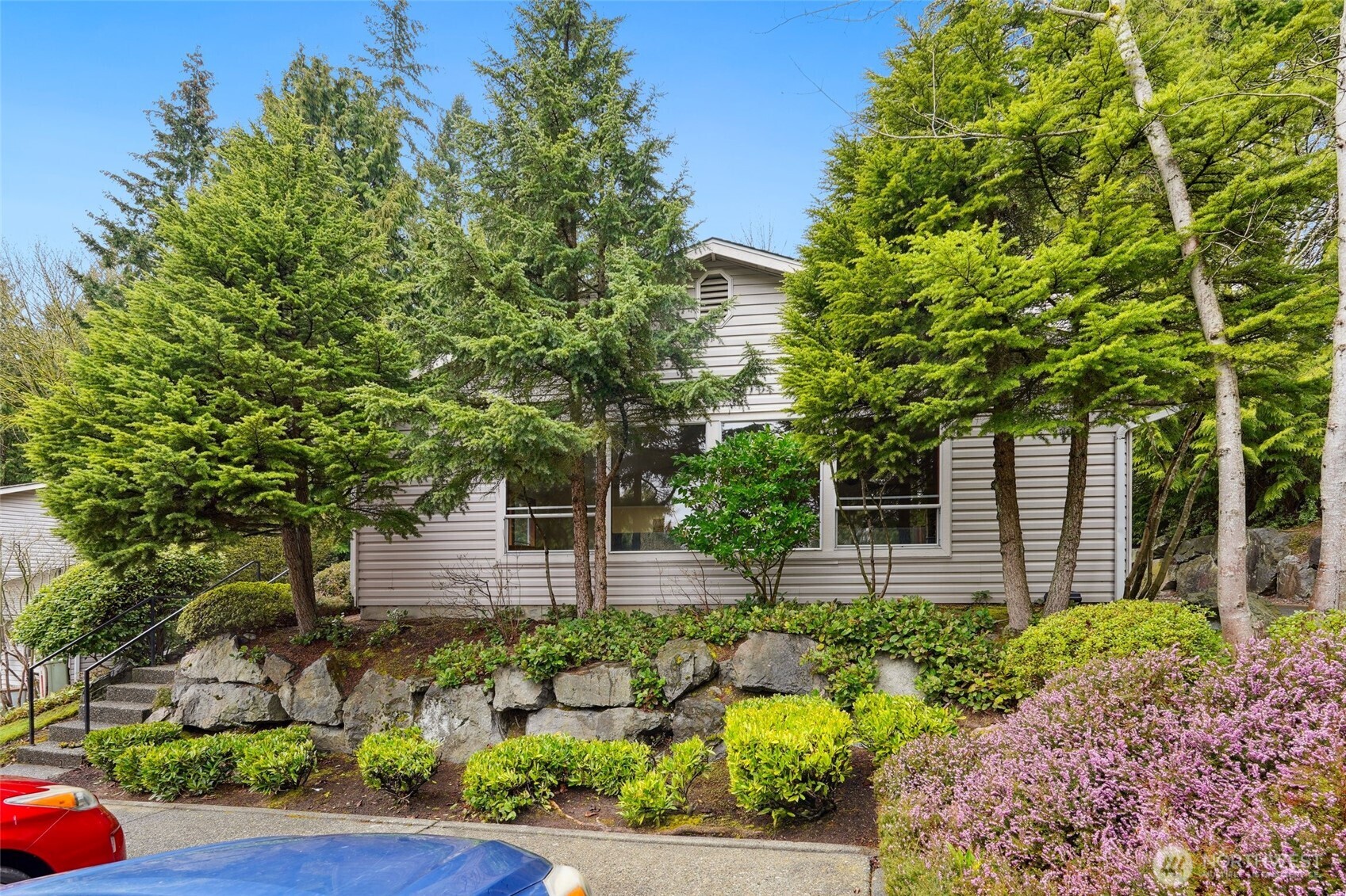 18910 Bothell Everett Highway, Unit K2 Bothell, WA 98012 - Photo 31 of 34 a front view of a house with a yard