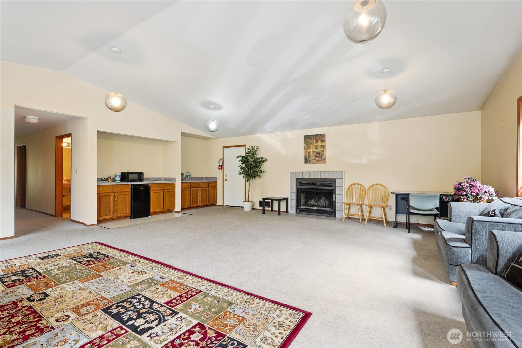 18910 Bothell Everett Highway, Unit K2 Bothell, WA 98012 - Photo 34 of 34 a living room with furniture and a fireplace