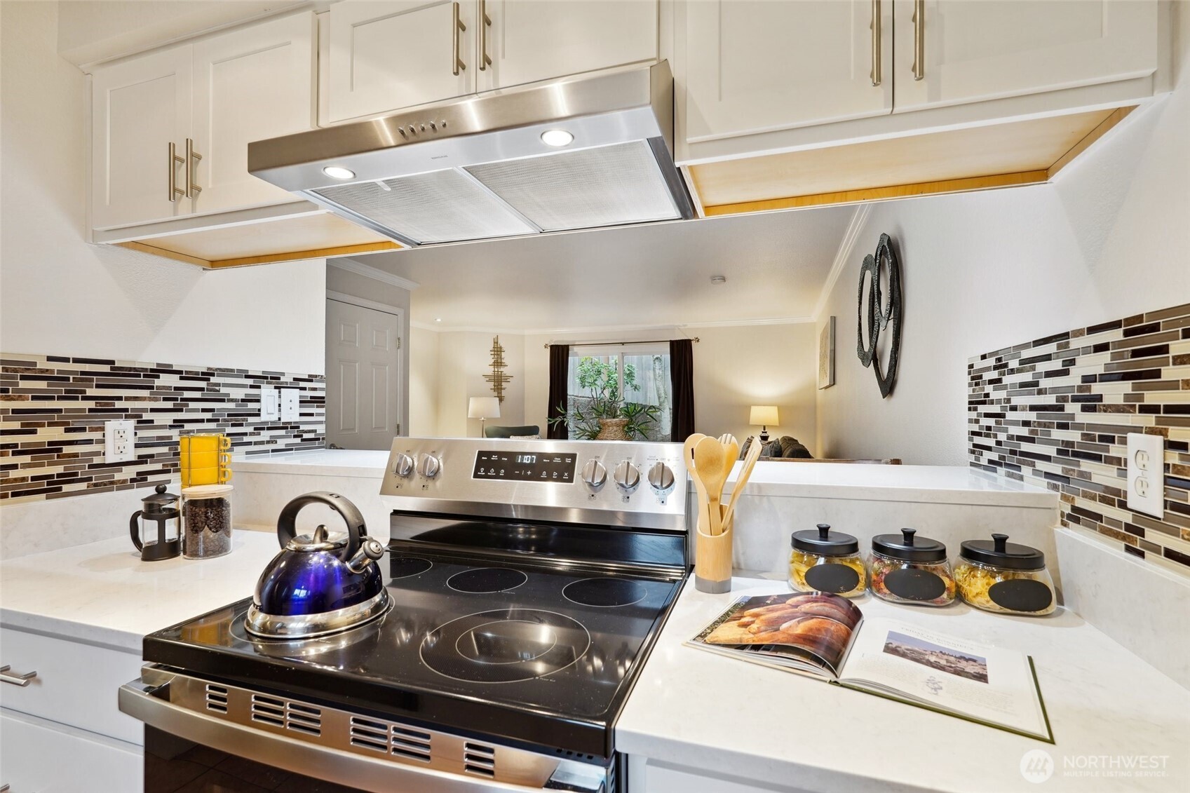 18910 Bothell Everett Highway, Unit K2 Bothell, WA 98012 - Photo 5 of 34 a kitchen with a stove and wooden cabinets