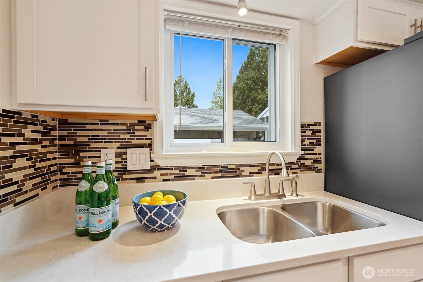 18910 Bothell Everett Highway, Unit K2 Bothell, WA 98012 - Photo 6 of 34 a kitchen with a sink and a potted plant