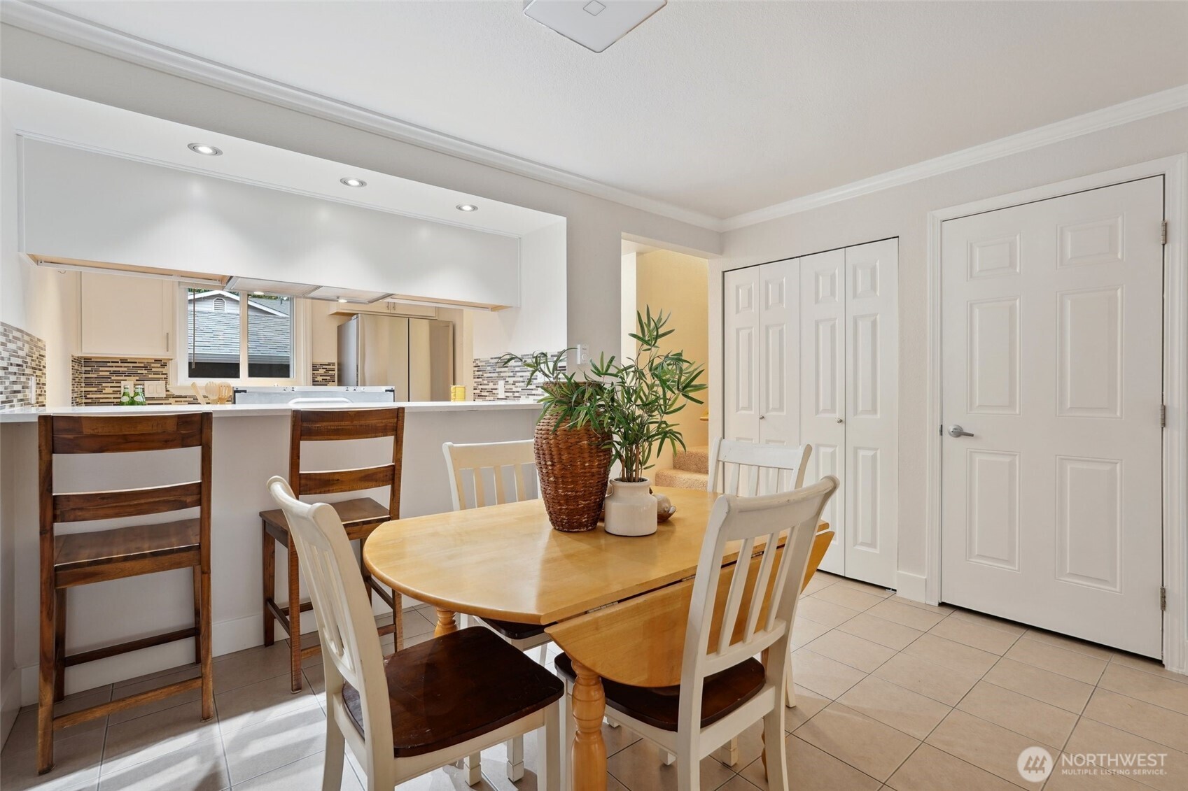 18910 Bothell Everett Highway, Unit K2 Bothell, WA 98012 - Photo 8 of 34 a dining room with furniture and window