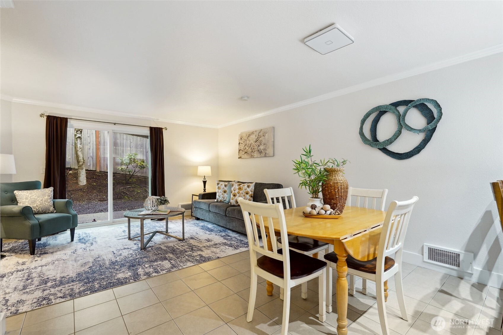 18910 Bothell Everett Highway, Unit K2 Bothell, WA 98012 - Photo 9 of 34 a dining room with furniture and a large window