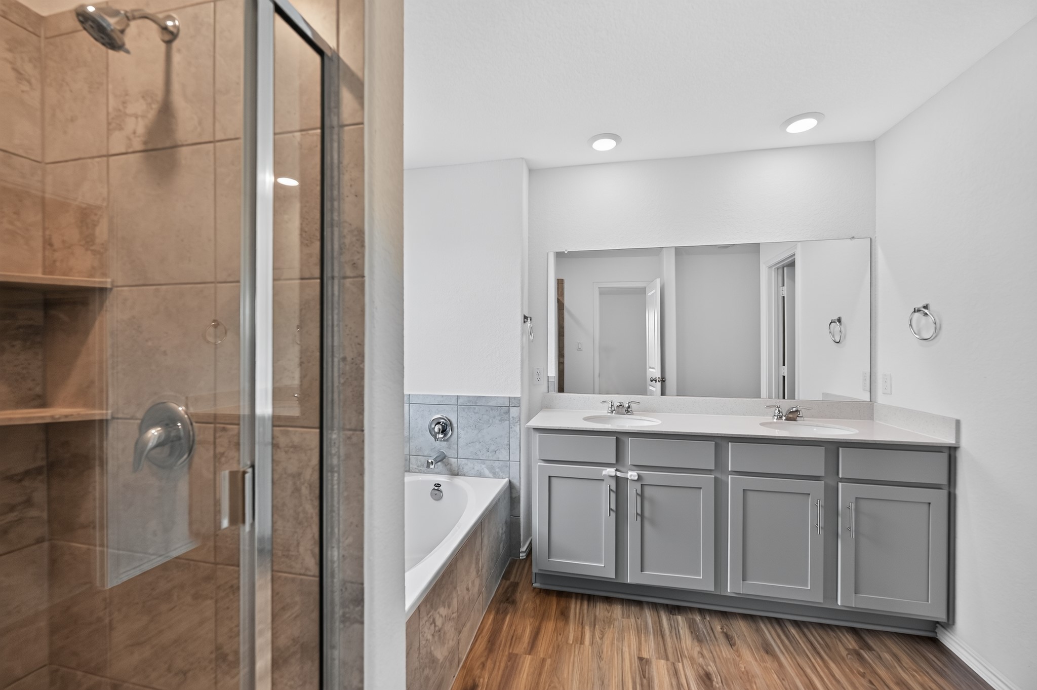 128 Konik Road Georgetown, TX 78626 - Photo 19 of 34 Dual vanity sinks provide ample space for morning routines in this functional bathroom.