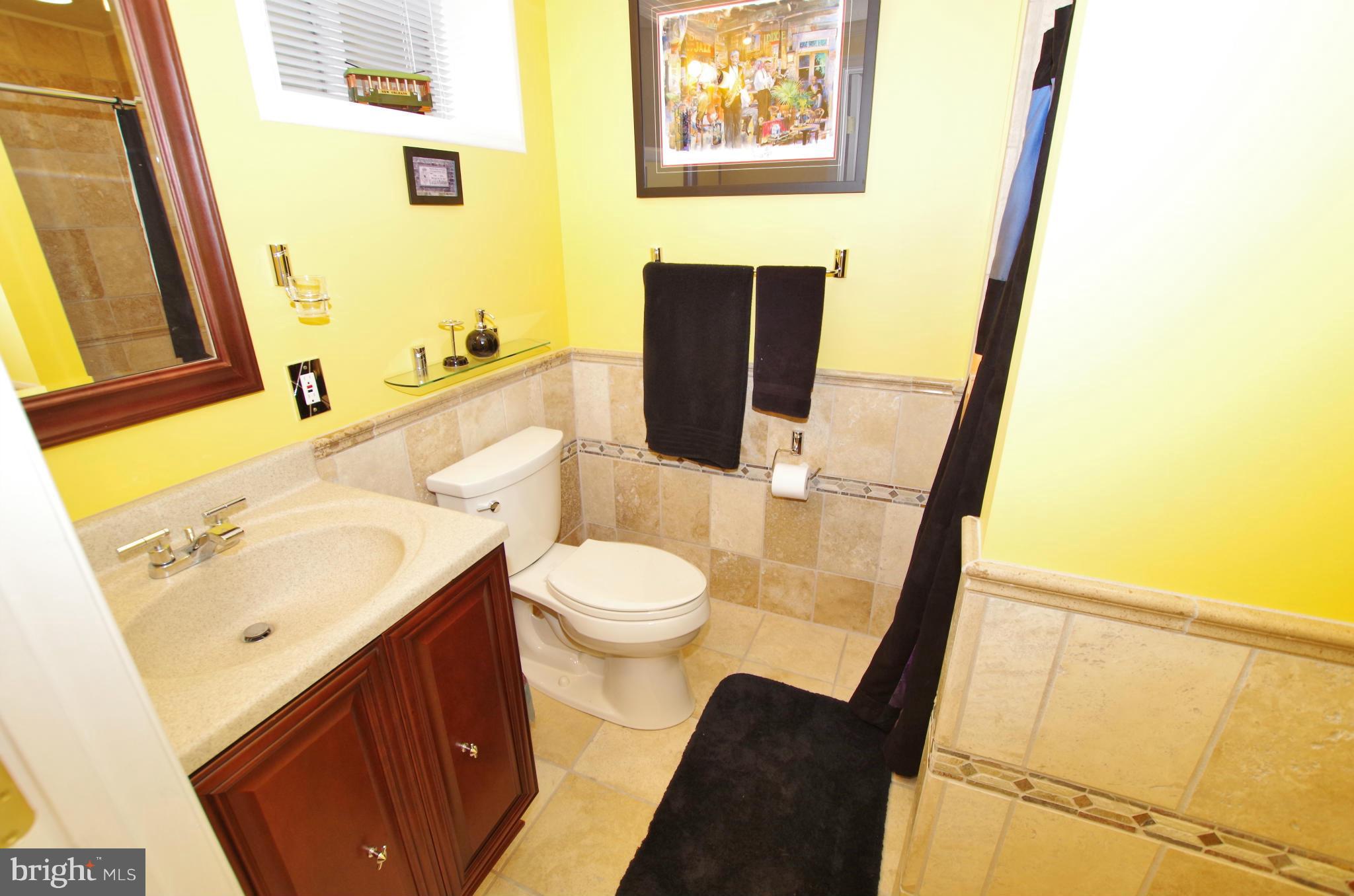 1711 Gayfields Drive Silver Spring, MD 20906 - Photo 24 of 30 Full Bathroom with Travertine Tile off Rec Room