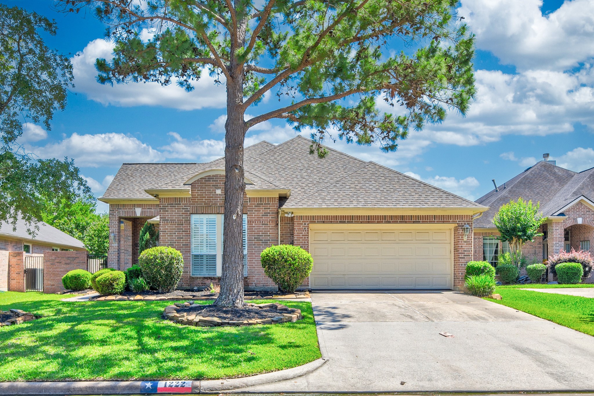 1222 Brinson Court Spring, TX 77379 - Photo 1 of 35 a front view of a house with garden
