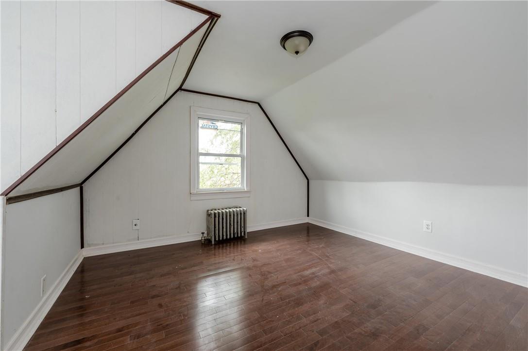 2855 Middletown Road Bronx, NY 10461 - Photo 12 of 19 an empty room with wooden floor and windows