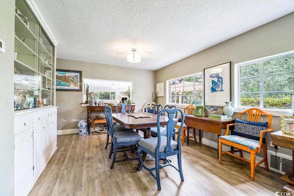 910 Willow Bank Road Georgetown, SC 29440 - Photo 22 of 40 Dining area featuring a textured ceiling and light wood-style floors