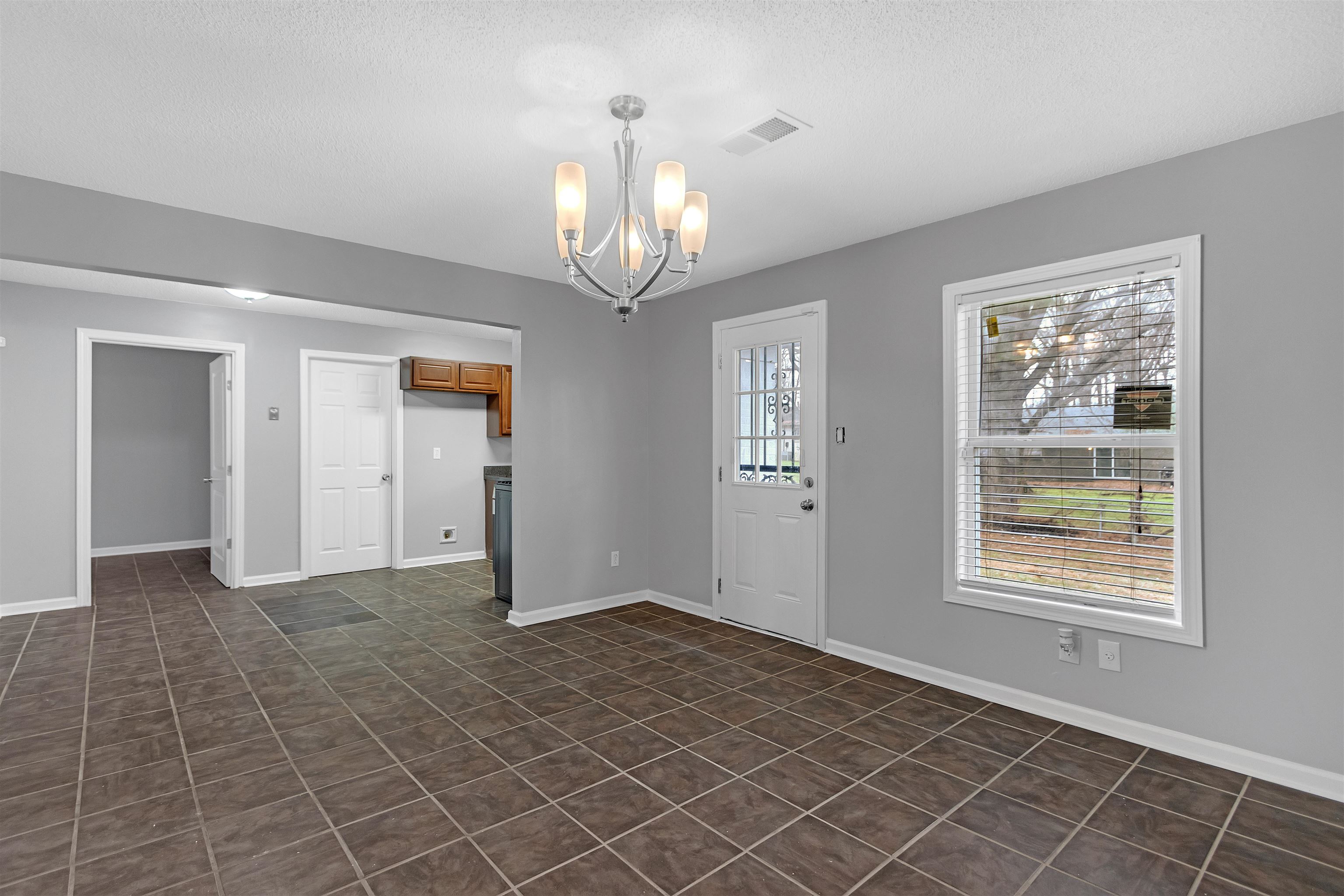3324 William Tell Drive Memphis, TN 38127 - Photo 7 of 28 Interior space with a notable chandelier and a textured ceiling