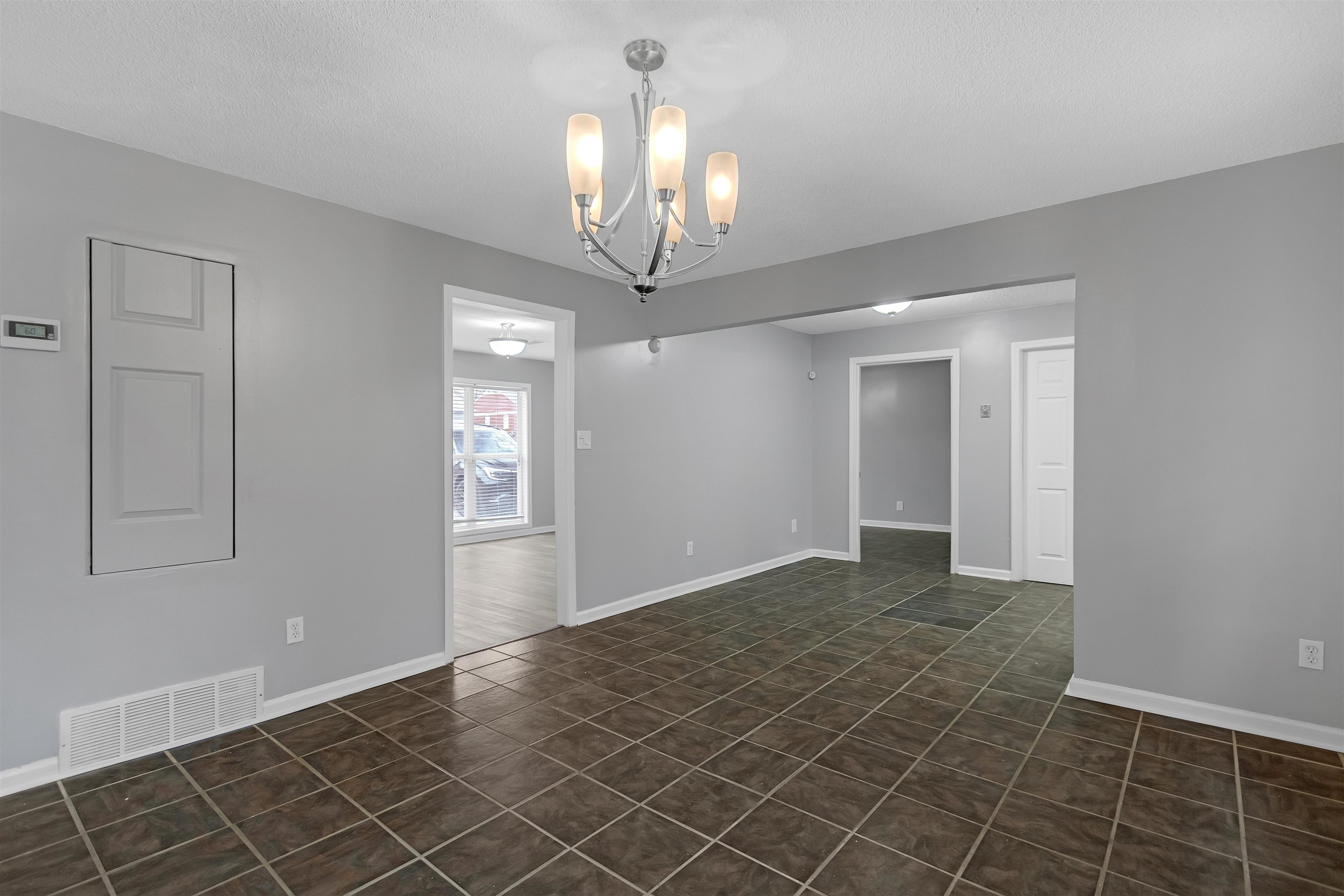 3324 William Tell Drive Memphis, TN 38127 - Photo 8 of 28 Spare room featuring a notable chandelier