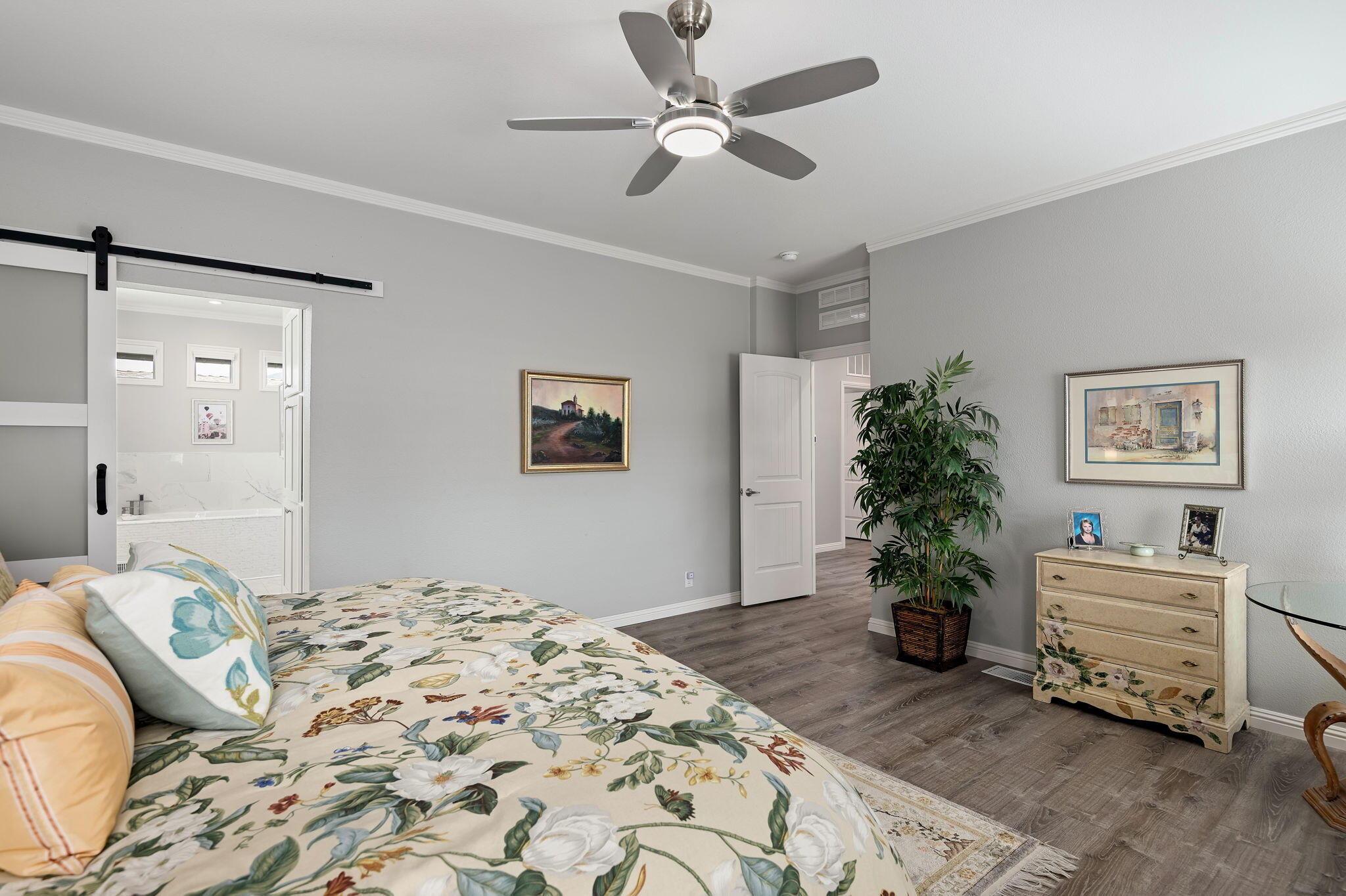 340 Old Mill Road, Unit 237 Santa Barbara, CA 93110 - Photo 16 of 30 a bedroom with a bed and a chandelier