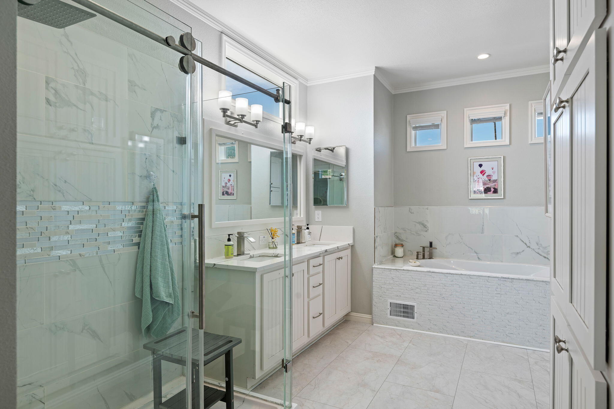 340 Old Mill Road, Unit 237 Santa Barbara, CA 93110 - Photo 17 of 30 a bathroom with a double vanity sink a toilet and shower