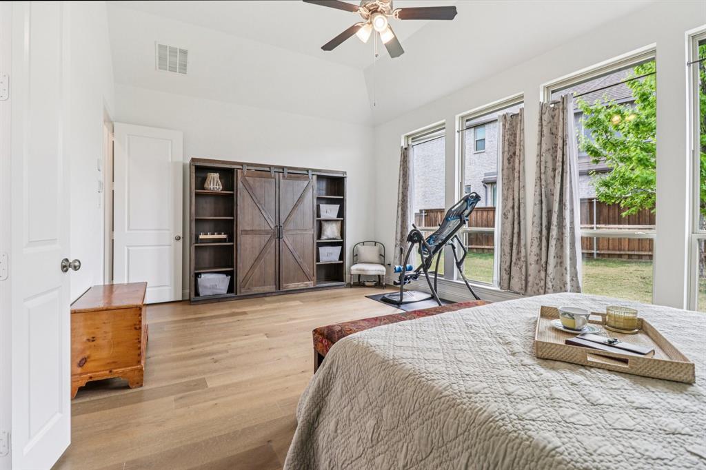 8277 Halifax The Colony, TX 75056 - Photo 15 of 37 a bedroom with bed and wooden floor