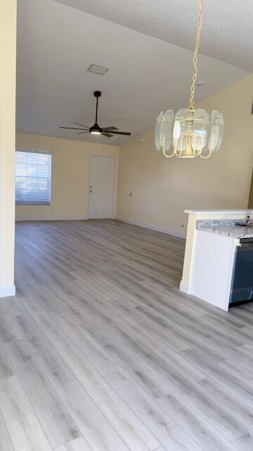4262 Southwest Jared Street Port St. Lucie, FL 34953 - Photo 13 of 29 a view of a room with wooden floor and ceiling fan