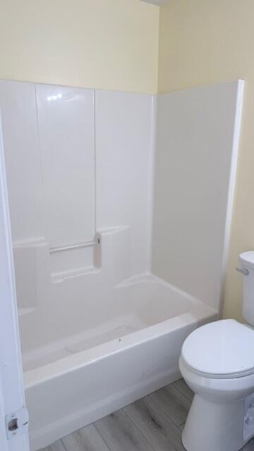 4262 Southwest Jared Street Port St. Lucie, FL 34953 - Photo 22 of 29 a bathroom with a bathtub and toilet