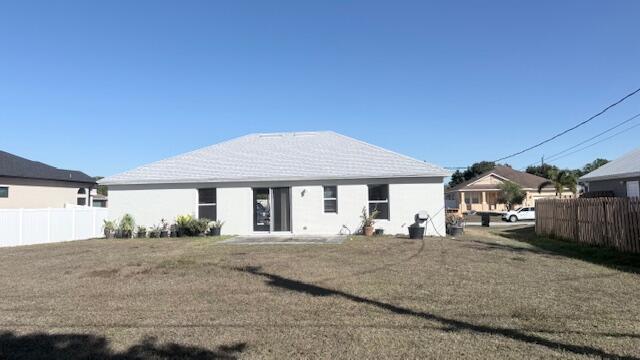 4262 Southwest Jared Street Port St. Lucie, FL 34953 - Photo 27 of 29 a front view of a house with a yard