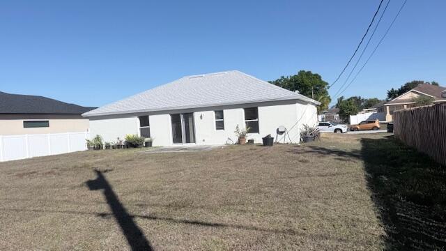 4262 Southwest Jared Street Port St. Lucie, FL 34953 - Photo 29 of 29 a view of a house with backyard and trees