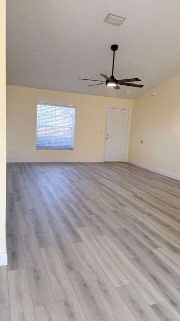 4262 Southwest Jared Street Port St. Lucie, FL 34953 - Photo 4 of 29 a view of empty room with wooden floor
