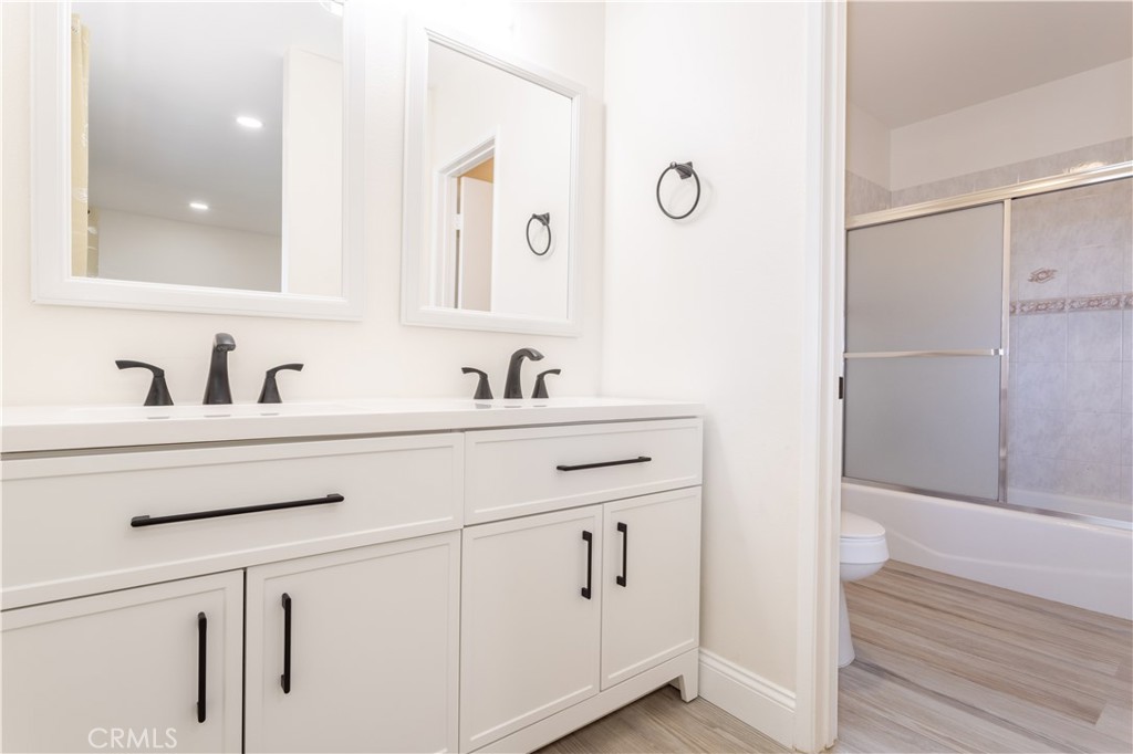 7809 Vía Udine Burbank, CA 91504 - Photo 14 of 34 a bathroom with a sink and a mirror