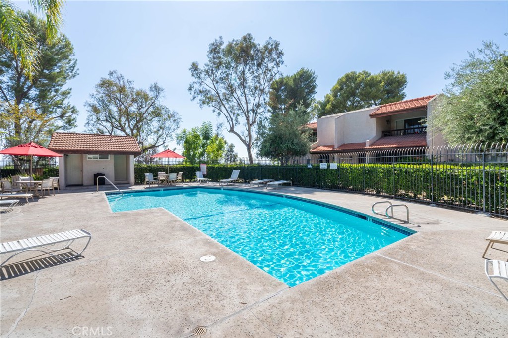 7809 Vía Udine Burbank, CA 91504 - Photo 31 of 34 a view of a house with swimming pool and a yard