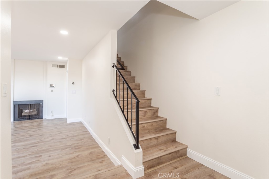 7809 Vía Udine Burbank, CA 91504 - Photo 9 of 34 a view of entryway and hall with wooden floor