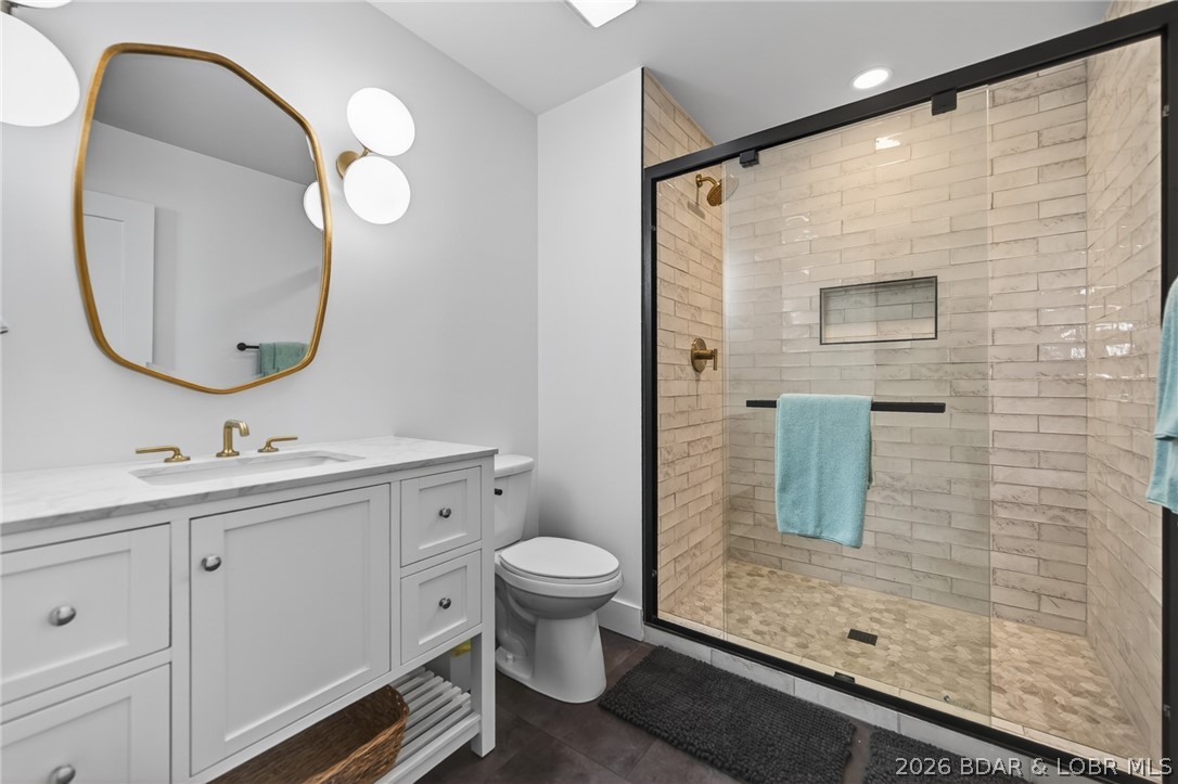 25 Old Sassafrass Road Eldon, MO 65026 - Photo 16 of 58 Lower level hall bath with new vanity, tile floor,