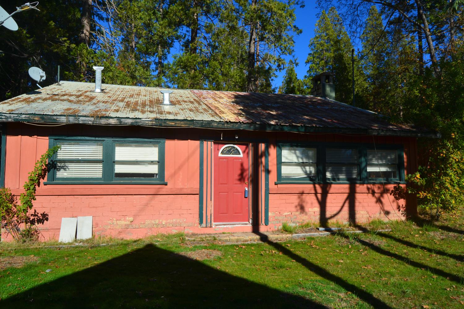 a view of house with backyard and swimming pool