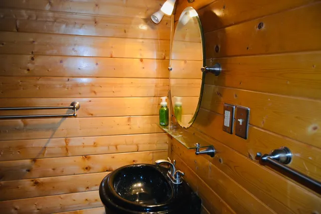 a bedroom with two beds and a window