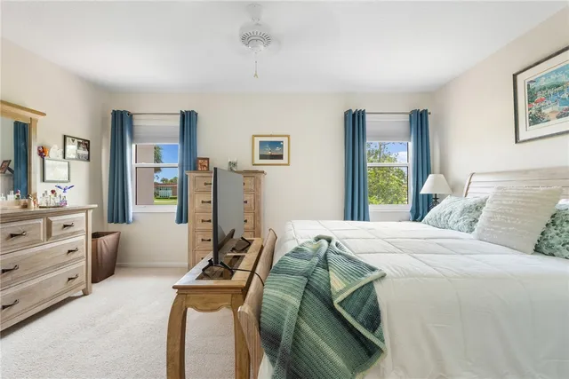 a bedroom with a bed and furniture