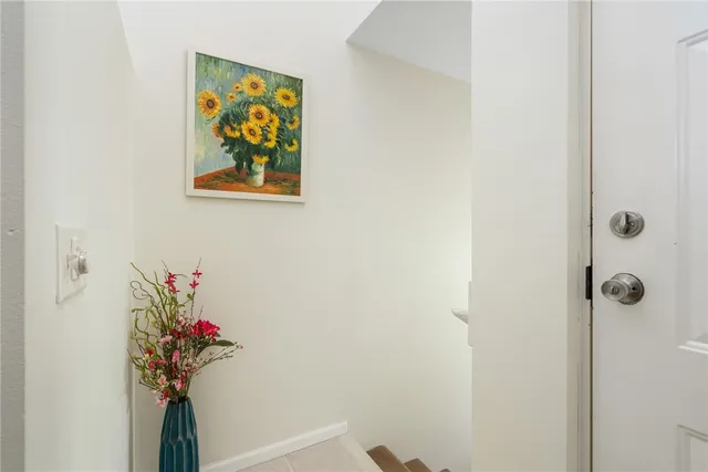 a view of a hallway with a flower pot