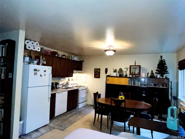 a kitchen with refrigerator and cabinets