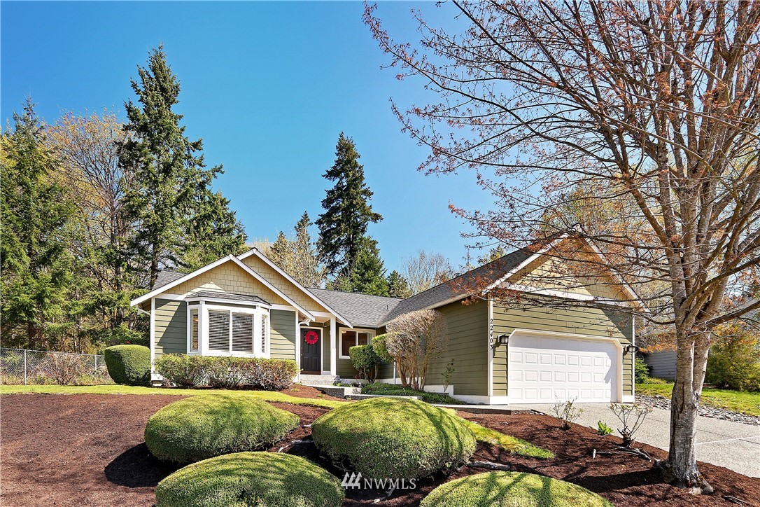 22403 15th Place West Bothell, WA 98021 - Photo 1 of 1 a front view of a house with a yard