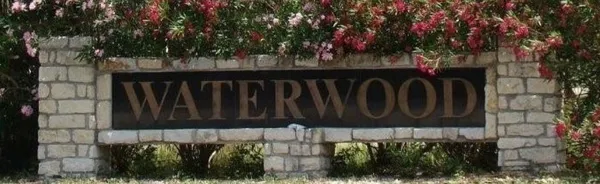 a street sign that is on a wooden wall