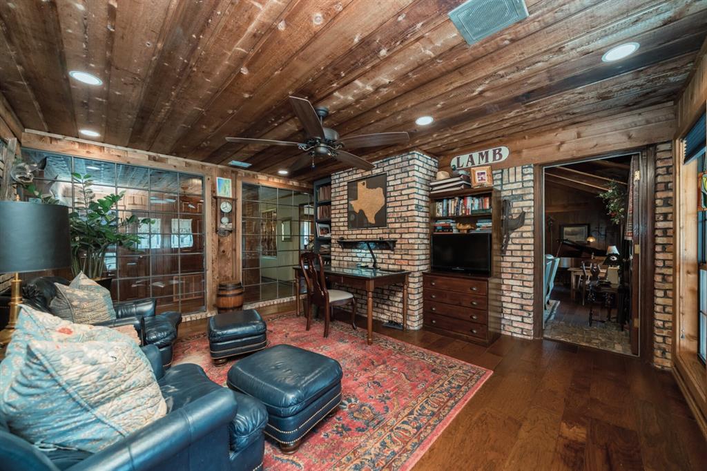 3843 Farm To Market 2199 Marshall, TX 75672 - Photo 12 of 40 a living room with furniture and a chandelier