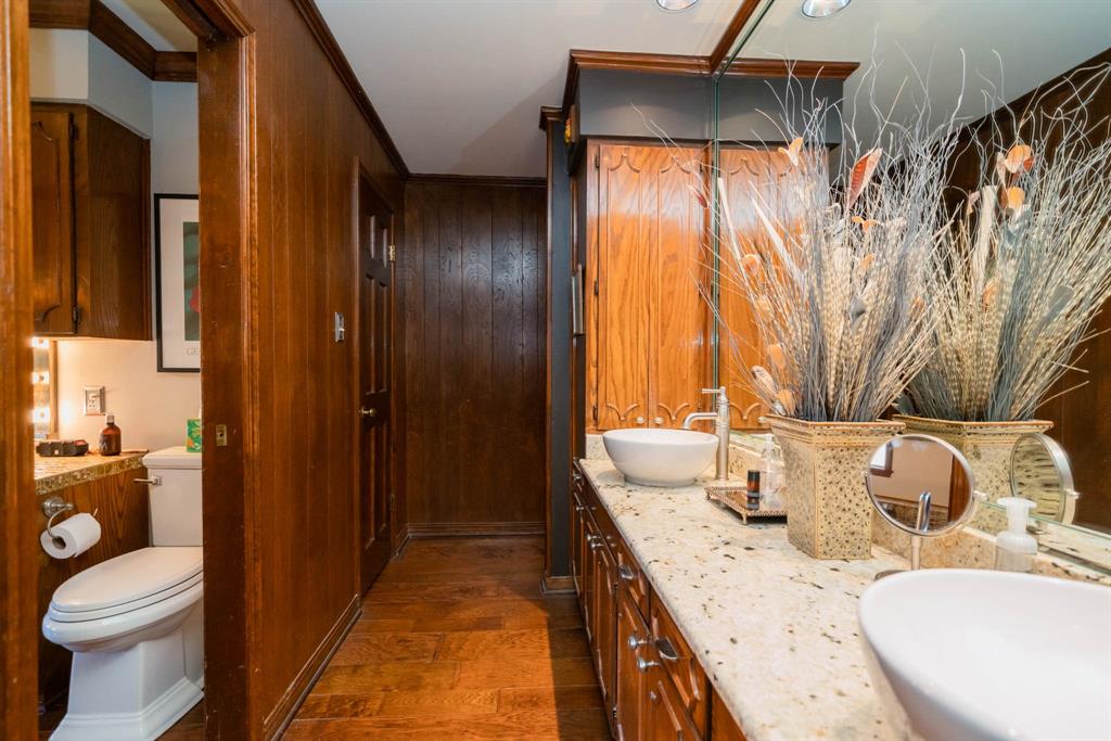 3843 Farm To Market 2199 Marshall, TX 75672 - Photo 15 of 40 a bathroom with a granite countertop sink and a mirror